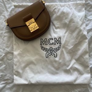 MCM womens crossbody also can be worn as a belt